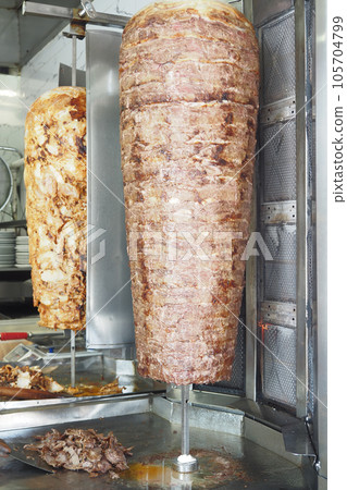 rotating traditional gyros meat close up rotating traditional gyros meat close up 105704799