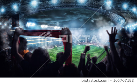 Football scene at night match with with cheering fans at the stadium Football scene at night match with with cheering fans at the stadium 105707198