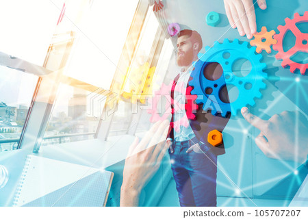 Thoughtful hipster businessman in the office. double exposure effects 105707207