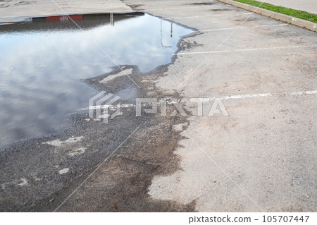 Parking lot under water. Weather conditions and sewage system Parking lot under water. Weather conditions and sewage system 105707447