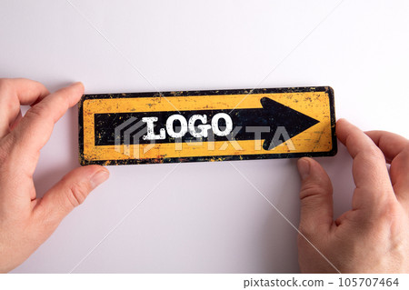 LOGO Concept. Direction arrow with text on white background LOGO Concept. Direction arrow with text on white background 105707464