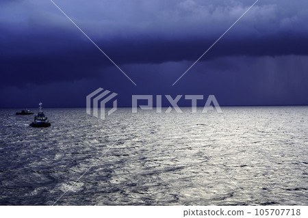 Rain storms approaching on the Sabang Ocean, Aceh, Indonesia with small ship against dark dramatic clouds Rain storms approaching on the Sabang Ocean, Aceh, Indonesia with small ship against dark dramatic clouds 105707718