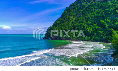 The beauty of Babah Ie Beach, Aceh with trees on the sandy beach against the blue sky The beauty of Babah Ie Beach, Aceh with trees on the sandy beach against the blue sky 105707731