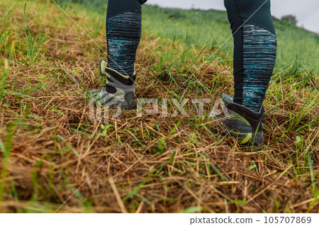Hiking boot. Close up of a mountain hikers feet. High quality photo Hiking boot. Close up of a mountain hikers feet. High quality photo 105707869