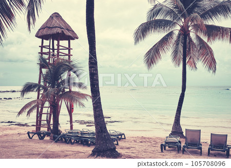 Retro toned picture of an empty tropical beach with lifeguard tower, Yucatan Peninsula, Mexico. 105708096