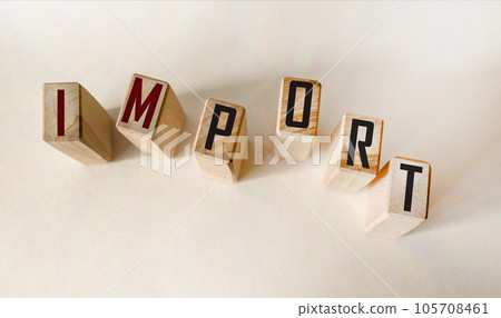 On a light table are wooden cubes with the inscription IMPORT. business concept On a light table are wooden cubes with the inscription IMPORT. business concept 105708461