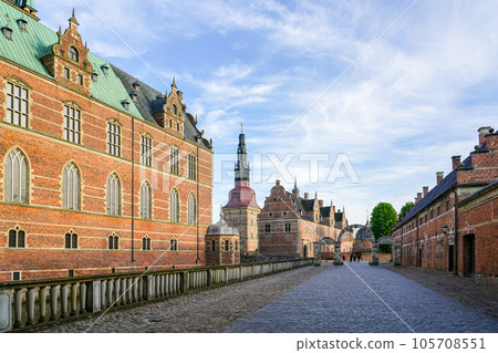 External view of renaissance Frederiksborg castle, palace in Hillerod, Denmark, street to entrance External view of renaissance Frederiksborg castle, palace in Hillerod, Denmark, street to entrance 105708551