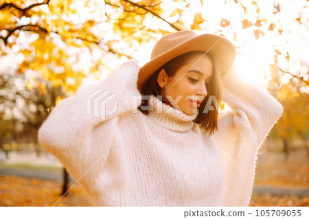 Young woman resting in nature. Fashion, style concept. People, lifestyle, relaxation and vacations. Young woman resting in nature. Fashion, style concept. People, lifestyle, relaxation and vacations. 105709055