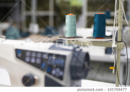 close-up of skeins of thread at an industrial sewing factory for tailoring clothes 105709477