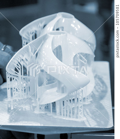Printed models on 3D printer close-up. Objects printed on photopolymer sla 3D printer from liquid photopolymer resins on printing platform. Modern progressive additive technology. 3D printer printing 105709581
