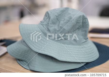 sewing hats on the head at a sewing factory 105709715