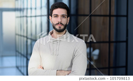 Portrait of a handsome businessman looking at camera Portrait of a handsome businessman looking at camera 105709813