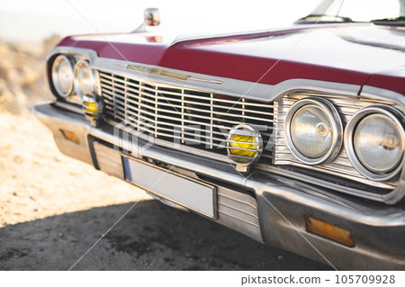 close-up of a retro car with front headlights close-up of a retro car with front headlights 105709928