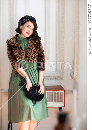 beautiful and happy brunette in retro clothes, beret and with a handbag. beautiful and happy brunette in retro clothes, beret and with a handbag. 105710897