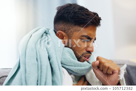 Sick, cough and healthcare with Indian man on sofa for influenza, illness and pain. Problem, medical and virus infection with guy suffering in living room at home for fatigue, disease and ache Sick, cough and healthcare with Indian man on sofa for influenza, illness and pain. Problem, medical and virus infection with guy suffering in living room at home for fatigue, disease and ache 105712382