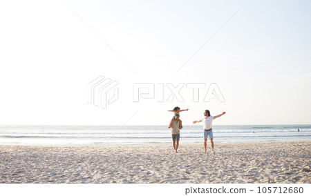 Beach, LGBT and playing kid, happy family and enjoy fun time walking on travel vacation, holiday or nature freedom. Sea water, mockup sky and gay couple, people or parents bonding with adoption child Beach, LGBT and playing kid, happy family and enjoy fun time walking on travel vacation, holiday or nature freedom. Sea water, mockup sky and gay couple, people or parents bonding with adoption child 105712680
