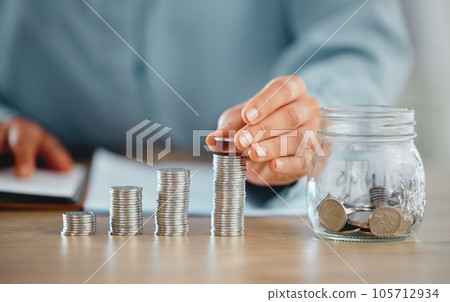 Hands holding coin pile to make a finance budget and successful financial choices. Closeup of money management and saving success. Stacked savings for the future, investment and retirement Hands holding coin pile to make a finance budget and successful financial choices. Closeup of money management and saving success. Stacked savings for the future, investment and retirement 105712934