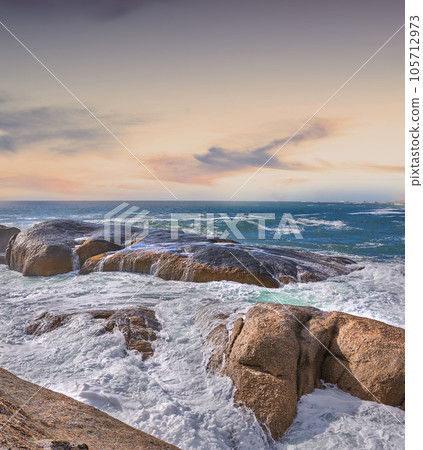 Beautiful, blue ocean view of a sea with a light, colorful sky copy space. Outdoor landscape of rocks and waves in nature on a summer beach day. Relaxing coastal setting outside with the sun shining Beautiful, blue ocean view of a sea with a light, colorful sky copy space. Outdoor landscape of rocks and waves in nature on a summer beach day. Relaxing coastal setting outside with the sun shining 105712973