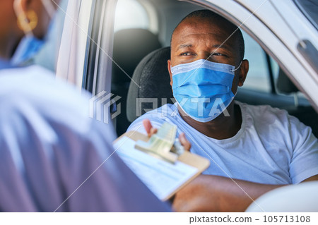 Test, interview and talking being done at a checkpoint during covid lockdown for traveling, transport and trips. Man wearing a mask to protect, keep safe and prevent sickness while filling in forms 105713108