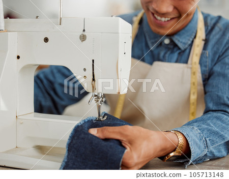 Design student, creative and worker in a studio sewing clothes and garments. Fashion student learning sewing machine skills in a textile and manufacturing studio. Happy trainee practicing his craft 105713148