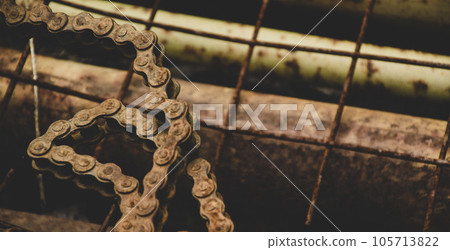 Scrap metal for recycling background. a lot of different rusty industrial part detail for melt and reused. Old rusty metal surface. Abstract background for design purpose. Warm orange color. Random Scrap metal for recycling background. a lot of different rusty industrial part detail for melt and reused. Old rusty metal surface. Abstract background for design purpose. Warm orange color. Random 105713822