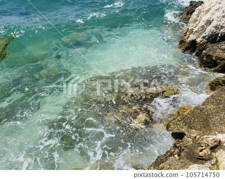 Rocky beach and crystal turquoise water of Ionian Sea in Albania. 105714750