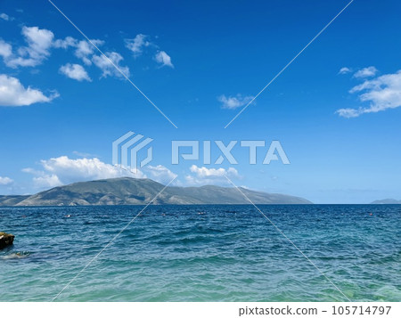 Rocky beach and crystal turquoise water of Ionian Sea in Albania. 105714797