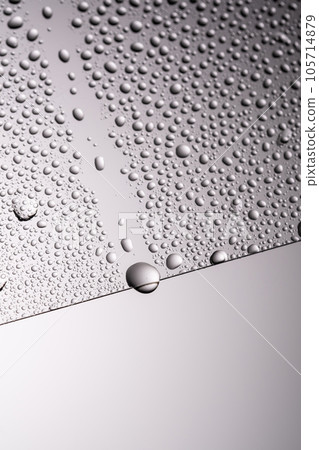 Drops of water on a transparent gray background. 105714879