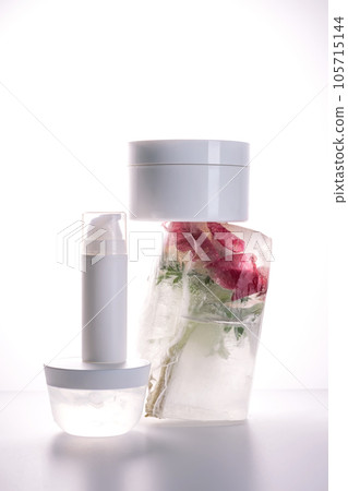 Gel and a jar of serum on a background of ice with flowers. 105715144
