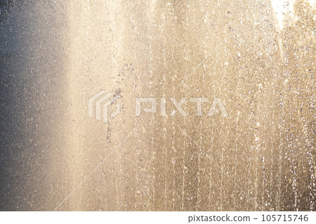 Beautiful background of water in the rays of the setting sun. Beautiful background of water in the rays of the setting sun. 105715746
