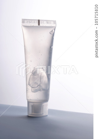 Transparent bottle of cosmetic gel on a white background. Transparent bottle of cosmetic gel on a white background. 105715810