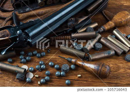 Hunting shotgun with brass cases and accessories for cartridge reloading. 105716043