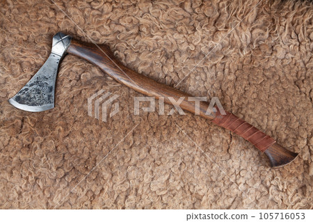 Battle axe on sheep fur 105716053