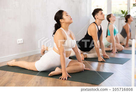 Pilates - young women and man with soft ball pilates Pilates - young women and man with soft ball pilates 105716808