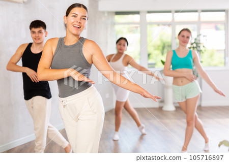 Young woman training dance positions during workout session Young woman training dance positions during workout session 105716897