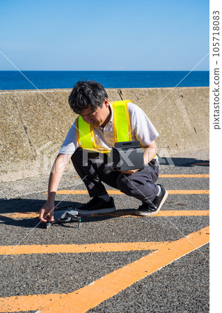 Male worker preparing for drone photography for infrastructure inspection | Drone inspection image Male worker preparing for drone photography for infrastructure inspection | Drone inspection image 105718083
