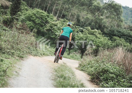 Riding bike in spring forest 105718241