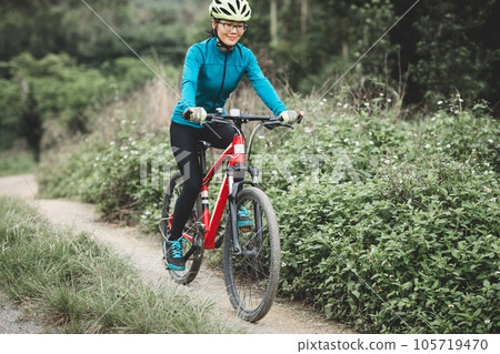 Riding bike in spring forest 105719470