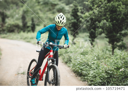 Riding bike in spring forest 105719471