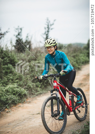 Riding bike in spring forest 105719472