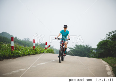 Riding bike in spring forest 105719511