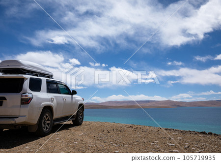 Driving off road car on the high altitude mountains 105719935