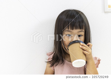 Woman Drinking Coffee Out Of A Paper Cup Stock Photo, Picture and