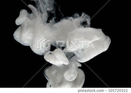 Abstract paint splash isolated on black background. Acrylic ink in water. selective focus. Abstract paint splash isolated on black background. Acrylic ink in water. selective focus. 105720322