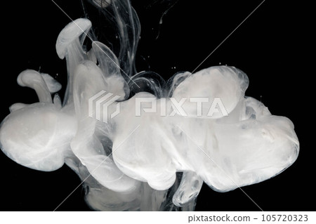 Abstract paint splash isolated on black background. Acrylic ink in water. selective focus. 105720323