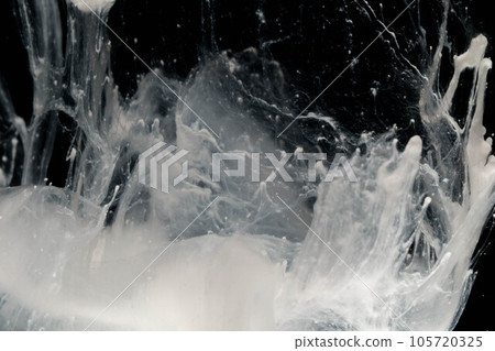 Abstract paint splash isolated on black background. Acrylic ink in water. selective focus. 105720325