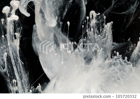 Abstract paint splash isolated on black background. Acrylic ink in water. selective focus. 105720332