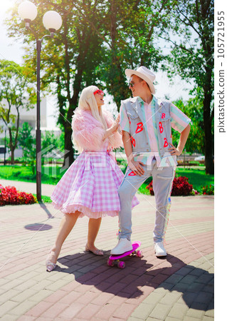 Beautiful barbie girl and boyfriend ken walking around the city  105721955