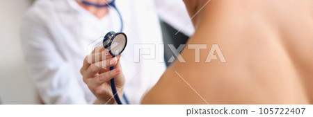 Female cardiologist examining problems with heart of male patient in clinic. 105722407