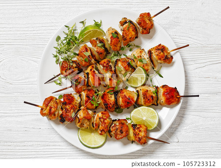 chicken souvlaki with thyme and lime on plate chicken souvlaki with thyme and lime on plate 105723312